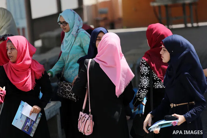 Palestinian high school students celebrate after heard their results of final exams known as "Tawjihi" in Gaza city on July 12, 2016. Photo by Mohammed Asad
