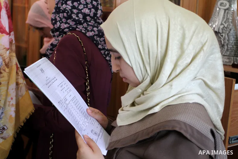 Palestinian high school students look for their results of final high school exams, known as "Tawjihi" in Rafah in the southern Gaza strip on July 12, 2016. Photo by Abed Rahim Khatib
