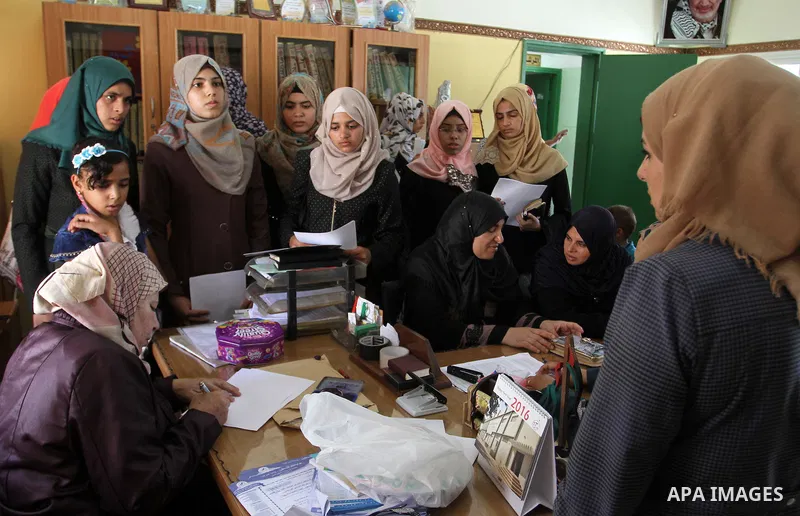 Palestinian high school students look for their results of final high school exams, known as "Tawjihi" in Rafah in the southern Gaza strip on July 12, 2016. Photo by Abed Rahim Khatib