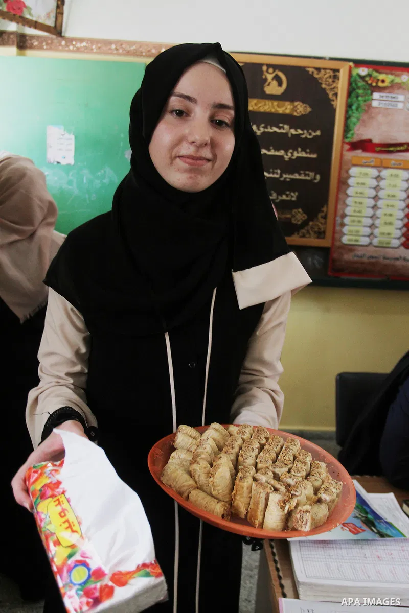 Palestinian high school students celebrate after heard their results of final exams known as "Tawjihi" in Rafah in the southern Gaza strip on July 12, 2016. Photo by Abed Rahim Khatib