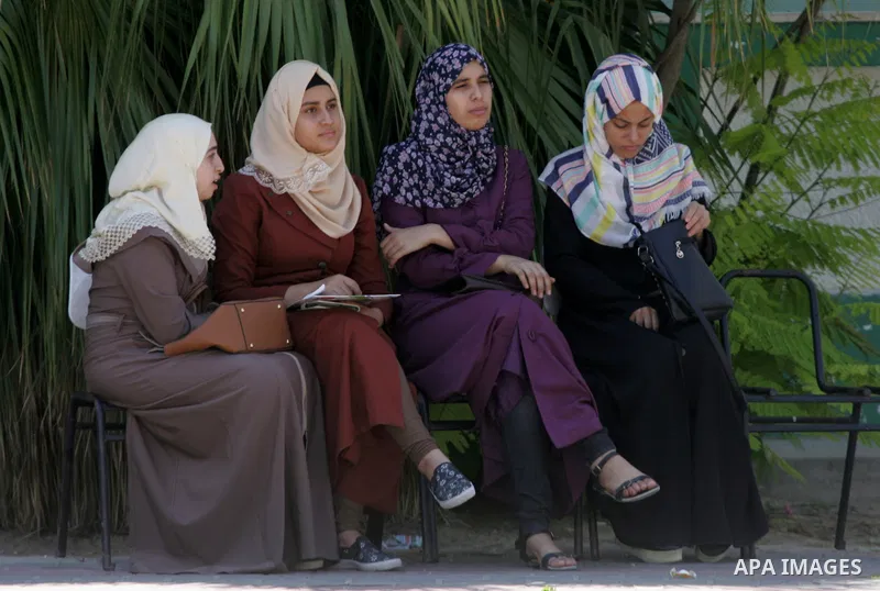 Palestinian high school students celebrate after heard their results of final exams known as "Tawjihi" in Rafah in the southern Gaza strip on July 12, 2016. Photo by Abed Rahim Khatib