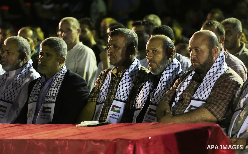 Palestinians participate in a memorial service for Al-Batsh family, who were killed during the recent Israeli war on Gaza Strip, in Shajaiyeh neighborhood in Gaza city, on July 12, 2016. Photo by Mohammed Asad