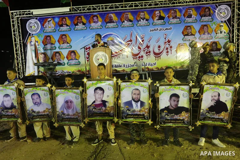 Palestinians participate in a memorial service for Al-Batsh family, who were killed during the recent Israeli war on Gaza Strip, in Shajaiyeh neighborhood in Gaza city, on July 12, 2016. Photo by Mohammed Asad