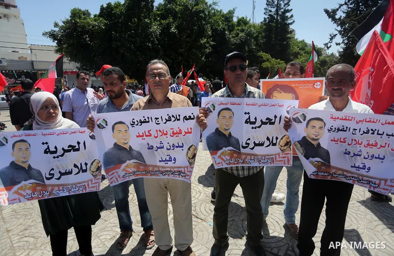 Supporters of the Popular Front for the Liberation of Palestine (PFLP) take part in a demonstration calling for the release of Bilal Kayed a Palestinian prisoner on hunger strike, in Gaza city on July 13, 2016. Photo by...
