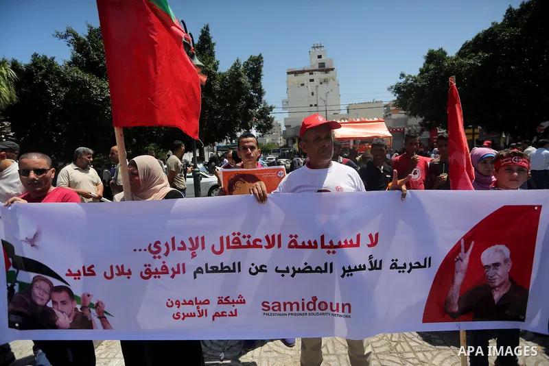 Supporters of the Popular Front for the Liberation of Palestine (PFLP) take part in a demonstration calling for the release of Bilal Kayed a Palestinian prisoner on hunger strike, in Gaza city on July 13, 2016. Photo by...