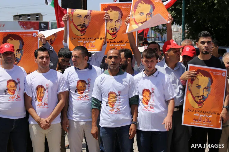 Supporters of the Popular Front for the Liberation of Palestine (PFLP) take part in a demonstration calling for the release of Bilal Kayed a Palestinian prisoner on hunger strike, in Gaza city on July 13, 2016. Photo by...