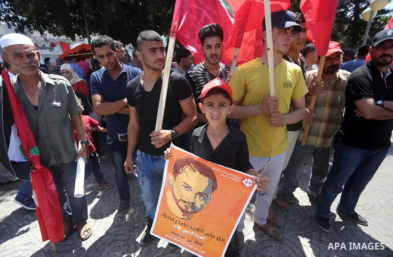 Supporters of the Popular Front for the Liberation of Palestine (PFLP) take part in a demonstration calling for the release of Bilal Kayed a Palestinian prisoner on hunger strike, in Gaza city on July 13, 2016. Photo by...