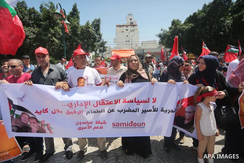 Supporters of the Popular Front for the Liberation of Palestine (PFLP) take part in a demonstration calling for the release of Bilal Kayed a Palestinian prisoner on hunger strike, in Gaza city on July 13, 2016. Photo by...