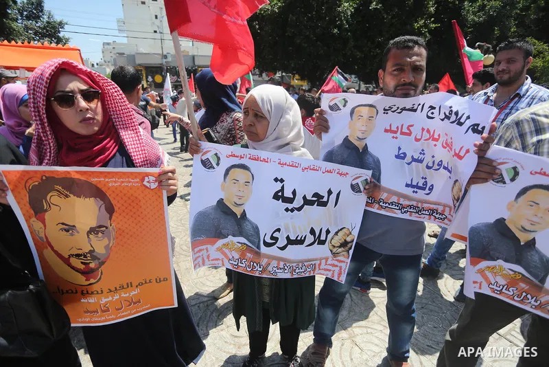 Supporters of the Popular Front for the Liberation of Palestine (PFLP) take part in a demonstration calling for the release of Bilal Kayed a Palestinian prisoner on hunger strike, in Gaza city on July 13, 2016. Photo by...