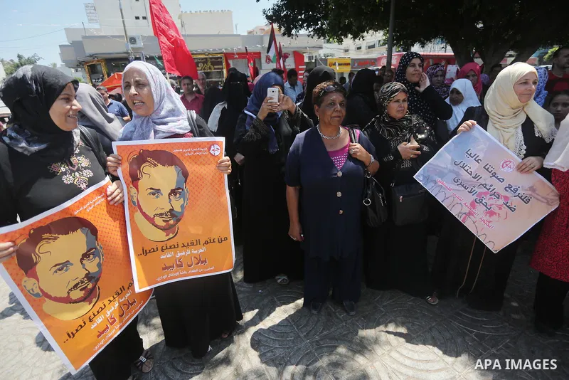 Supporters of the Popular Front for the Liberation of Palestine (PFLP) take part in a demonstration calling for the release of Bilal Kayed a Palestinian prisoner on hunger strike, in Gaza city on July 13, 2016. Photo by...