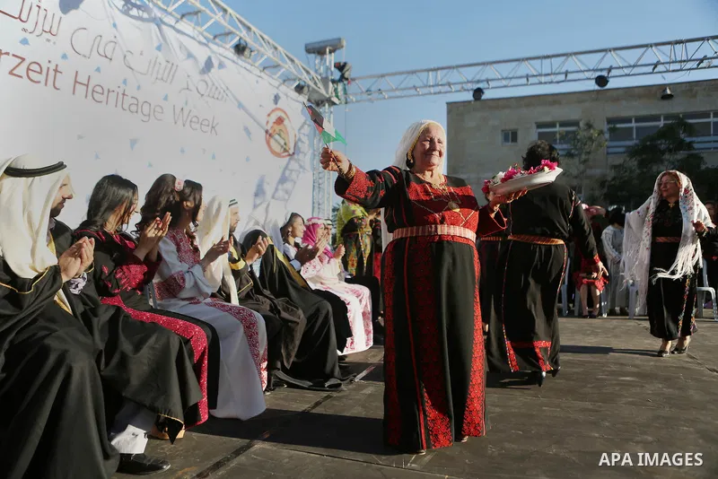 Palestinians celebrate during a wedding in Heritage week in the village of Bir Zeit, in the West Bank near Ramallah, on July 13, 2016. Photo by Shadi Hatem