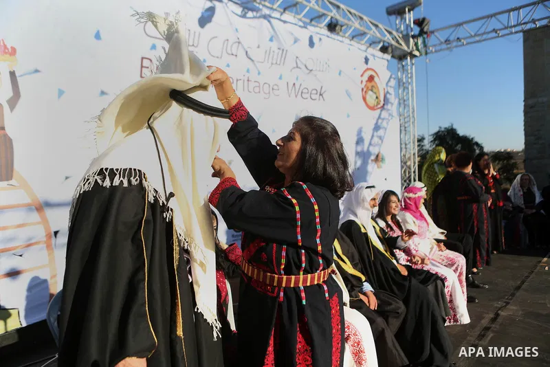 Palestinians celebrate during a wedding in Heritage week in the village of Bir Zeit, in the West Bank near Ramallah, on July 13, 2016. Photo by Shadi Hatem