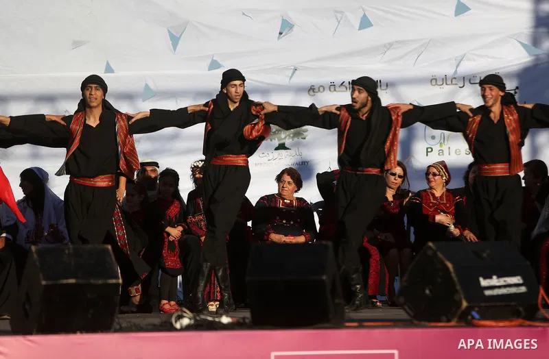 Palestinian youths dance during a wedding in Heritage week in the village of Bir Zeit, in the West Bank near Ramallah, on July 13, 2016. Photo by Shadi Hatem