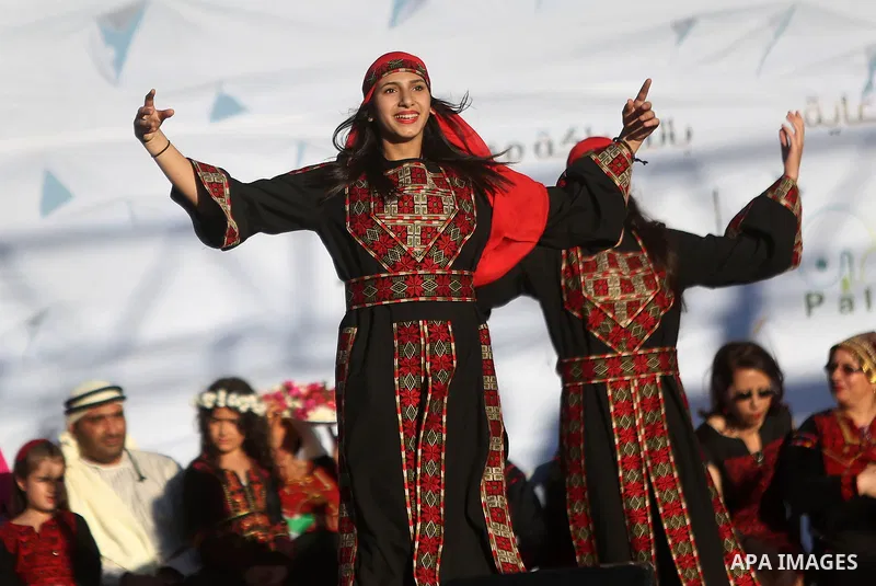 Palestinian youths dance during a wedding in Heritage week in the village of Bir Zeit, in the West Bank near Ramallah, on July 13, 2016. Photo by Shadi Hatem