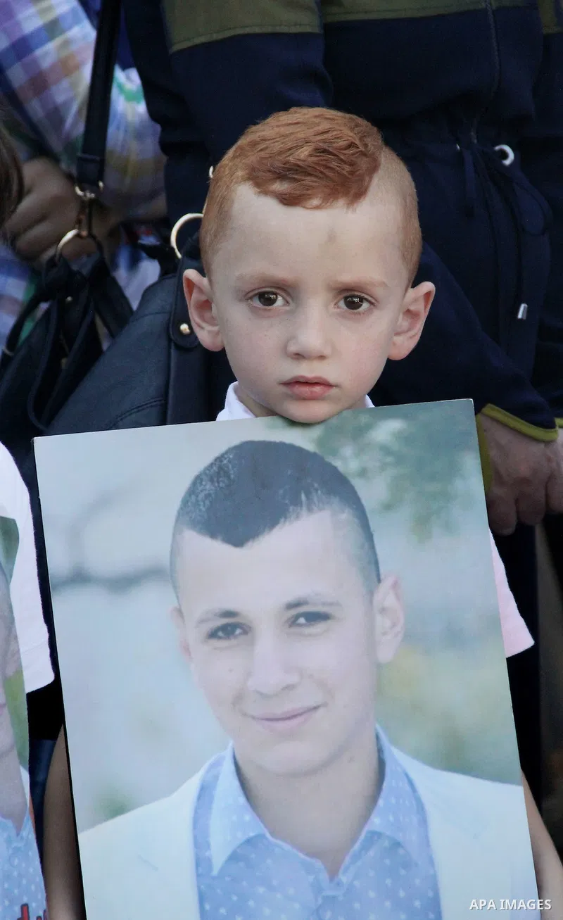 Relatives of Palestinian prisoners in Israeli jails take part in a protest against the decision of Israeli authorities minimize visits the Palestinian prisoners in front of Red cross office, in Jerusalem, on July 13, 201...