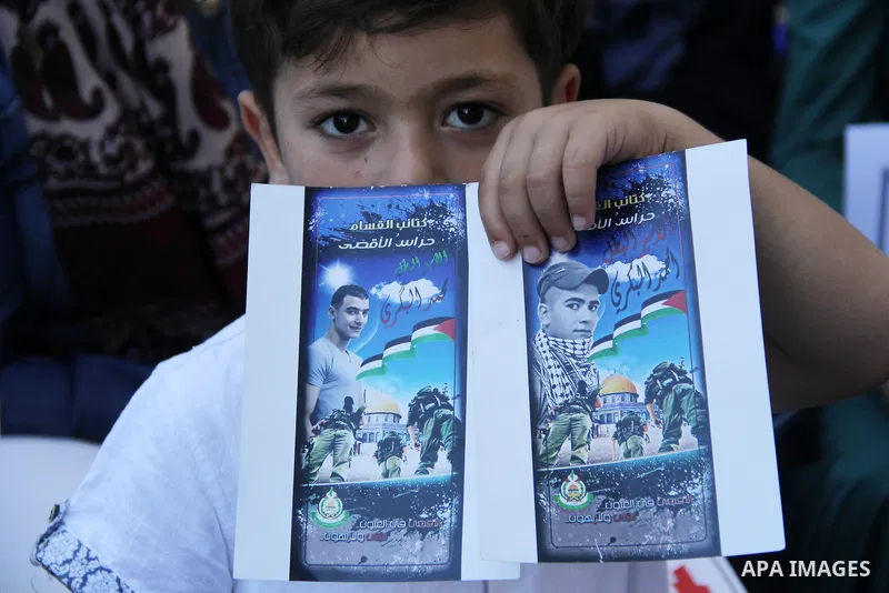 Relatives of Palestinian prisoners in Israeli jails take part in a protest against the decision of Israeli authorities minimize visits the Palestinian prisoners in front of Red cross office, in Jerusalem, on July 13, 201...
