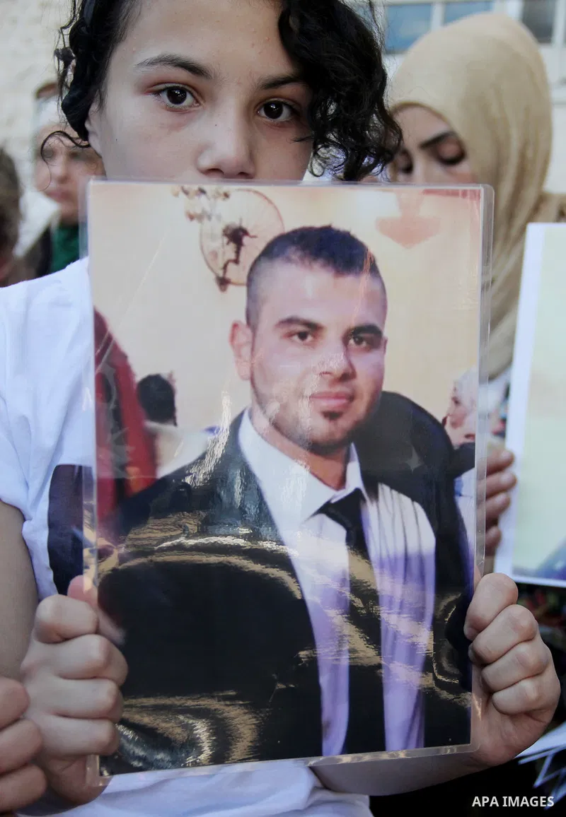 Relatives of Palestinian prisoners in Israeli jails take part in a protest against the decision of Israeli authorities minimize visits the Palestinian prisoners in front of Red cross office, in Jerusalem, on July 13, 201...