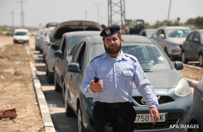 A Palestinian man inspects vehicles that came from Israel to serve the Gaza Strip market on July 14, 2016 in the Palestinian side of the Erez crossing with Israel. Israel opened the major Erez crossing point between Isra...