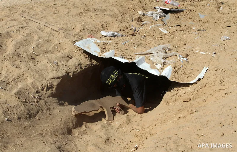 Young Palestinians take part in a military-style exercise at a summer camp organised by the Islamic Jihad movement in Khan Yunis in the southern Gaza Strip, during the youngsters' summer school vacation, on July 14, 2016...