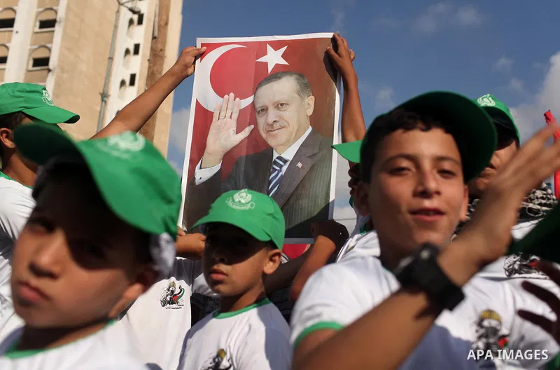 Palestinians hold banners during a protest against military coup attempt in Turkey, in Khan Younis in the southern Gaza strip, on July 16, 2016. President Recep Tayyip Erdogan battled to regain control over Turkey on Jul...