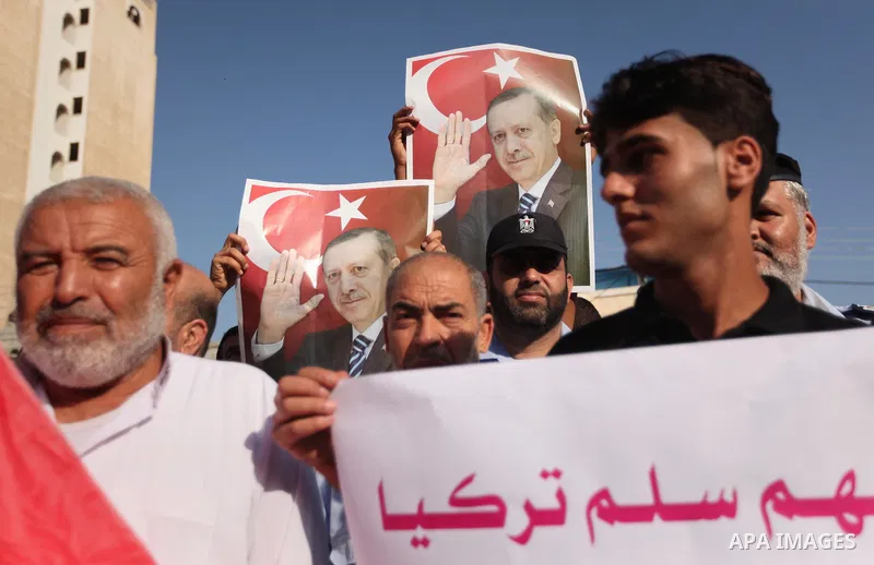 Palestinians hold banners during a protest against military coup attempt in Turkey, in Khan Younis in the southern Gaza strip, on July 16, 2016. President Recep Tayyip Erdogan battled to regain control over Turkey on Jul...