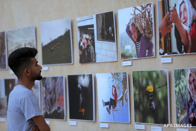 Palestinians participate in a photo gallery Within the activities of Heritage week in the village of Bir Zeit, in the West Bank near Ramallah on july 16, 2016. . Photo by Shadi Hatem