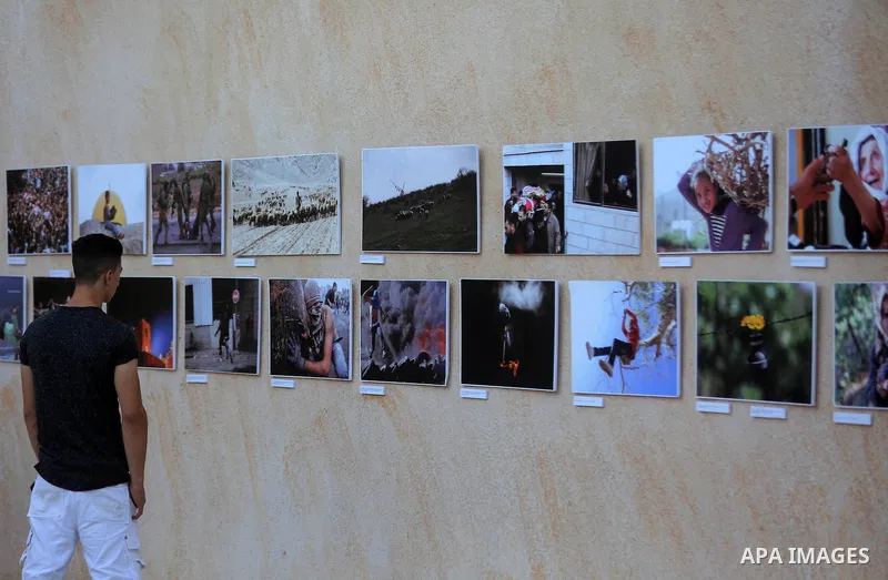 Palestinians participate in a photo gallery Within the activities of Heritage week in the village of Bir Zeit, in the West Bank near Ramallah on july 16, 2016. . Photo by Shadi Hatem
