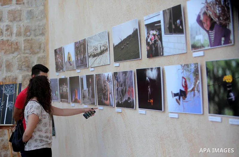 Palestinians participate in a photo gallery Within the activities of Heritage week in the village of Bir Zeit, in the West Bank near Ramallah on july 16, 2016. . Photo by Shadi Hatem