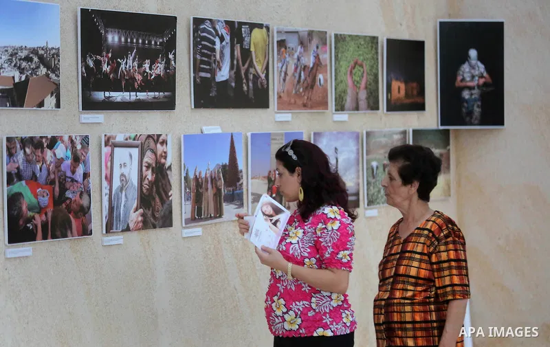 Palestinians participate in a photo gallery Within the activities of Heritage week in the village of Bir Zeit, in the West Bank near Ramallah on july 16, 2016. . Photo by Shadi Hatem