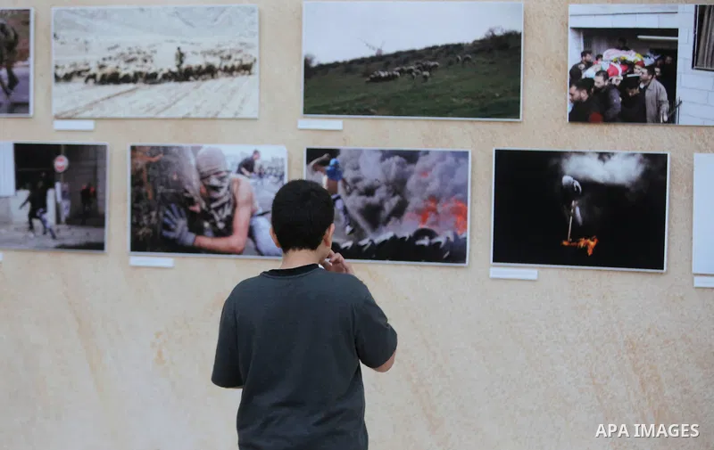 Palestinians participate in a photo gallery Within the activities of Heritage week in the village of Bir Zeit, in the West Bank near Ramallah on july 16, 2016. . Photo by Shadi Hatem