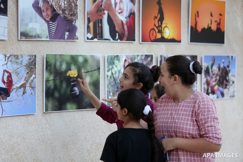 Palestinians participate in a photo gallery Within the activities of Heritage week in the village of Bir Zeit, in the West Bank near Ramallah on july 16, 2016. . Photo by Shadi Hatem