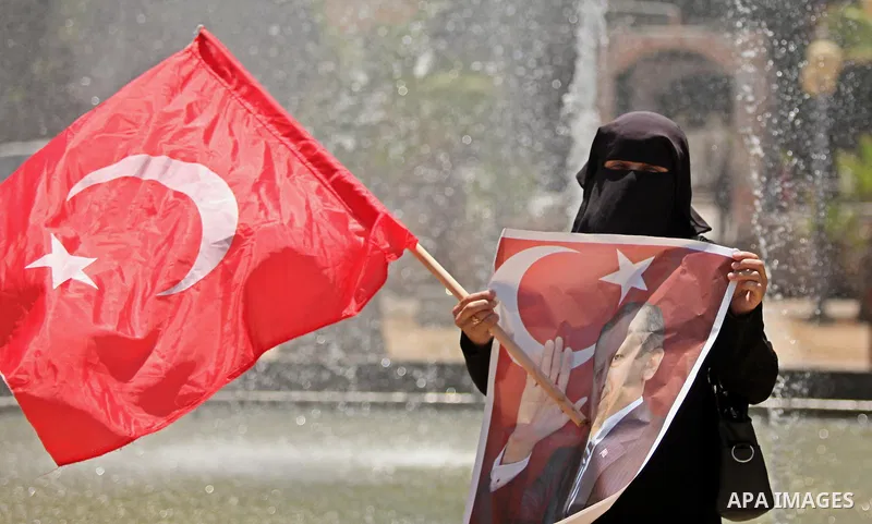 Palestinian supporters of the Hamas movement hold portraits of Turkish President Recep Tayyip Erdogan as they shout slogans against the military coup attempt in Turkey, during a demonstration in Gaza City, on July 17, 20...