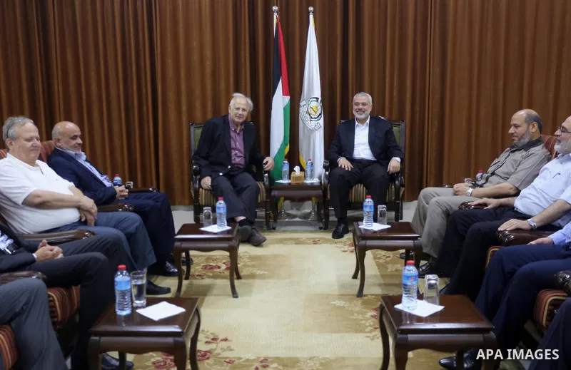 Senior Hamas leader Ismail Haniyeh meets with Palestinian Central Elections Commission chief, Hanna Nasser, in Gaza city on July 17, 2016. Photo by Mohammed Asad