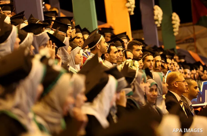 Palestinian students participate in their graduation ceremony at the University College of Applied Sciences in Gaza city on July 17, 2016. Photo by Mohammed Asad
