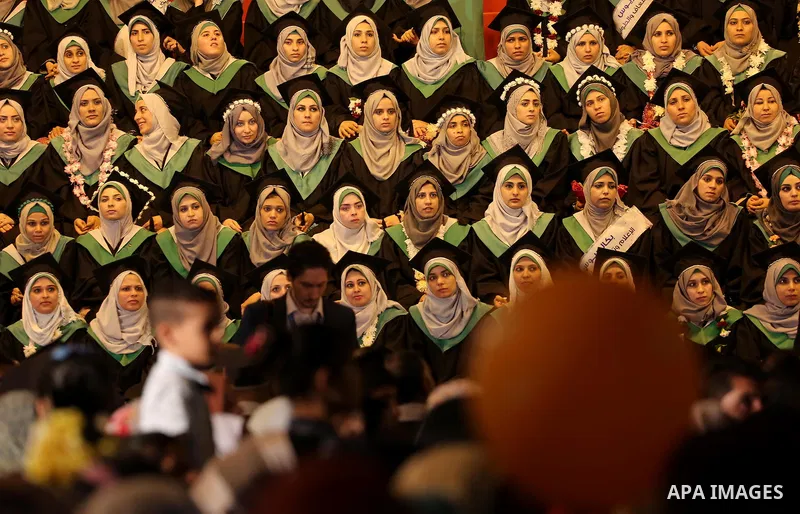 Palestinian students participate in their graduation ceremony at the University College of Applied Sciences in Gaza city on July 17, 2016. Photo by Mohammed Asad