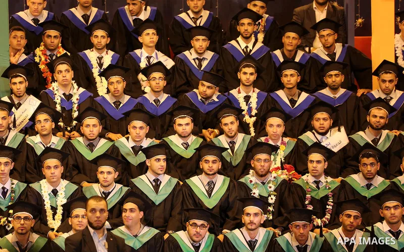 Palestinian students participate in their graduation ceremony at the University College of Applied Sciences in Gaza city on July 17, 2016. Photo by Mohammed Asad