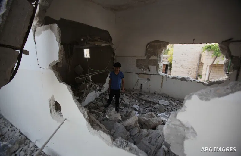 A Palestinian man checks on July 18, 2016 the rubble of a house belonging to a Palestinian man accused by Israeli authorities in taking part in an attack in Jerusalem in which an Israeli policewoman was killed, after it...