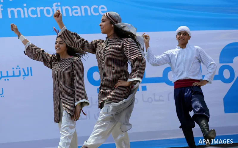 Palestinians youth participate in dancing of "Dabka" during the opening of an exhibition, in Gaza city, on July 18, 2016. Photo by Mohammed Asad