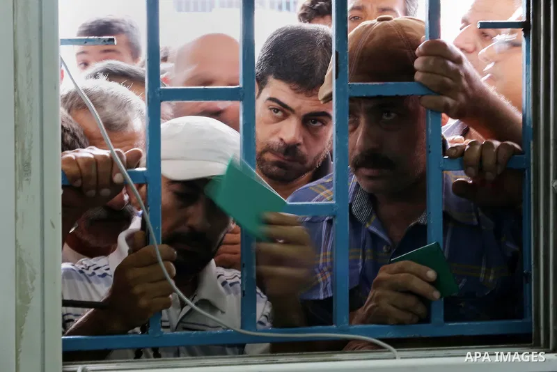 Palestinians receive Turkish aid at an aid distribution centre in Gaza city, on July 19, 2016. The aid, consisting of flour, sugar and rice, was allowed into the Palestinian territory via Israel’s Kerem Shalom crossing a...