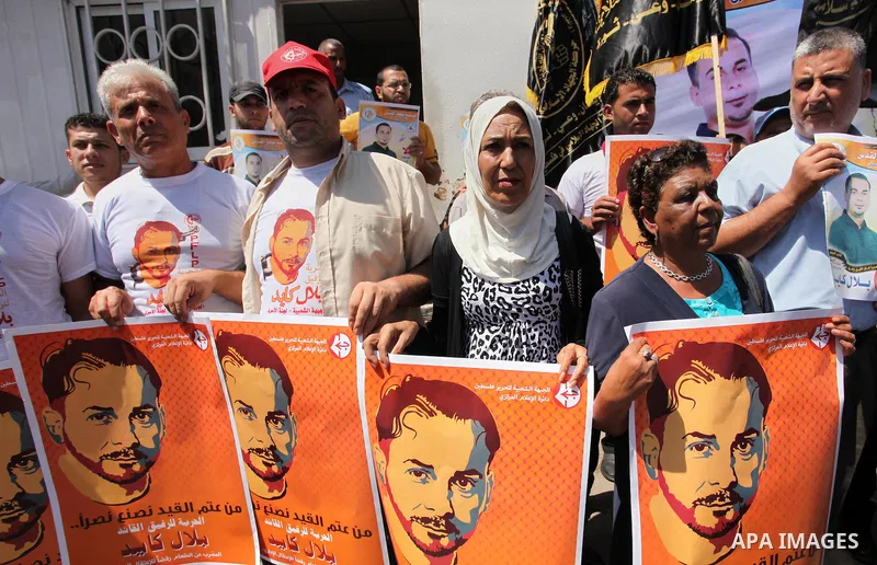 Palestinians take part in a protest calling for the release of Bilal Kayed a Palestinian prisoner on hunger strike in front of the high commissioner for human rights headquarters in Gaza City, on June 19, 2016. Photo by...
