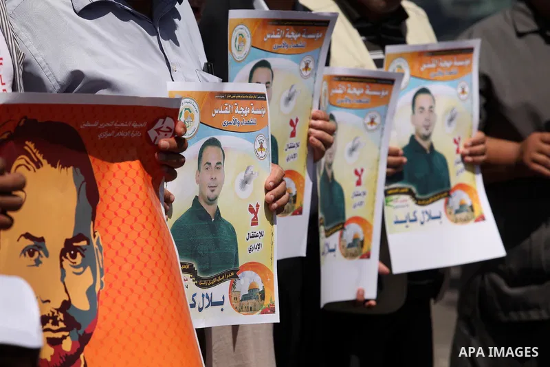 Palestinians take part in a protest calling for the release of Bilal Kayed a Palestinian prisoner on hunger strike in front of the high commissioner for human rights headquarters in Gaza City, on June 19, 2016. Photo by...