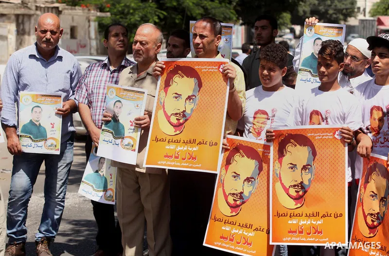 Palestinians take part in a protest calling for the release of Bilal Kayed a Palestinian prisoner on hunger strike in front of the high commissioner for human rights headquarters in Gaza City, on June 19, 2016. Photo by...