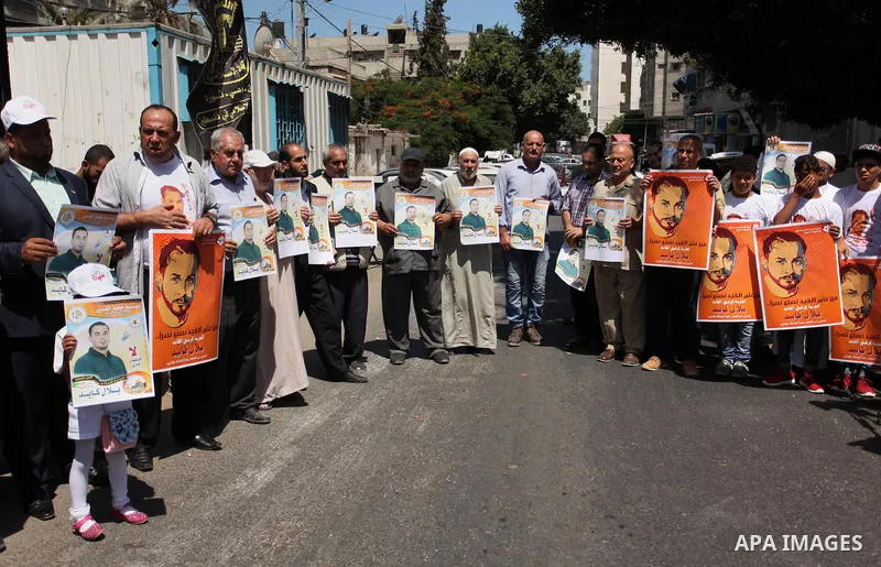 Palestinians take part in a protest calling for the release of Bilal Kayed a Palestinian prisoner on hunger strike in front of the high commissioner for human rights headquarters in Gaza City, on June 19, 2016. Photo by...