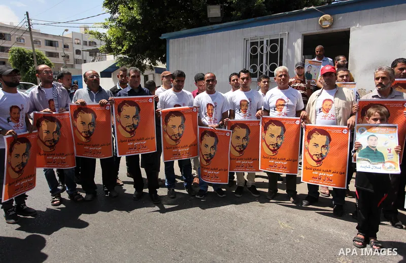 Palestinians take part in a protest calling for the release of Bilal Kayed a Palestinian prisoner on hunger strike in front of the high commissioner for human rights headquarters in Gaza City, on June 19, 2016. Photo by...