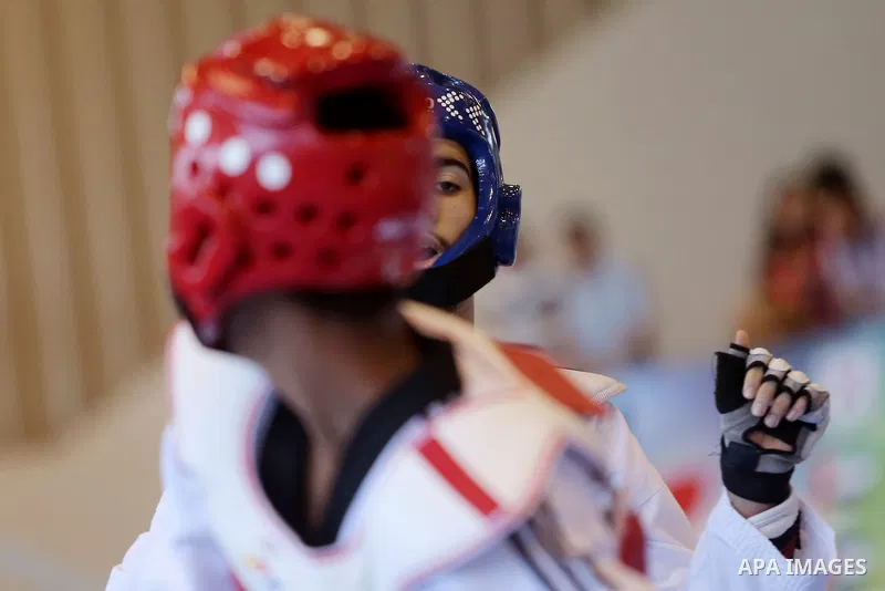 Taekwondo fighters spar during the International Taekwondo Championships at the Birzeit University in the West Bank city of Ramallah on July 19, 2016. Foreign football teams have already played matches in the Palestinian...