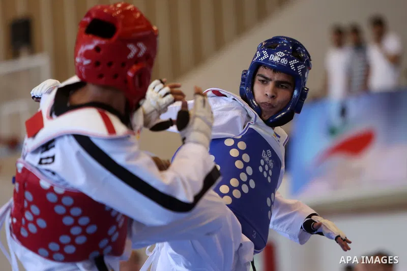 Taekwondo fighters spar during the International Taekwondo Championships at the Birzeit University in the West Bank city of Ramallah on July 19, 2016. Foreign football teams have already played matches in the Palestinian...