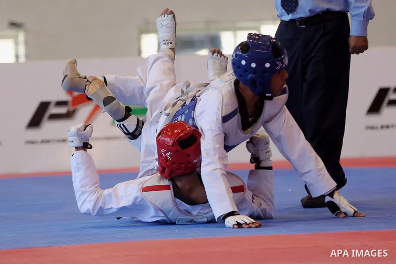 Taekwondo fighters spar during the International Taekwondo Championships at the Birzeit University in the West Bank city of Ramallah on July 19, 2016. Foreign football teams have already played matches in the Palestinian...