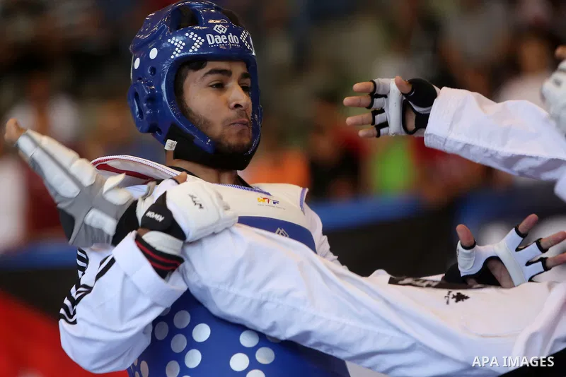 Taekwondo fighters spar during the International Taekwondo Championships at the Birzeit University in the West Bank city of Ramallah on July 19, 2016. Foreign football teams have already played matches in the Palestinian...