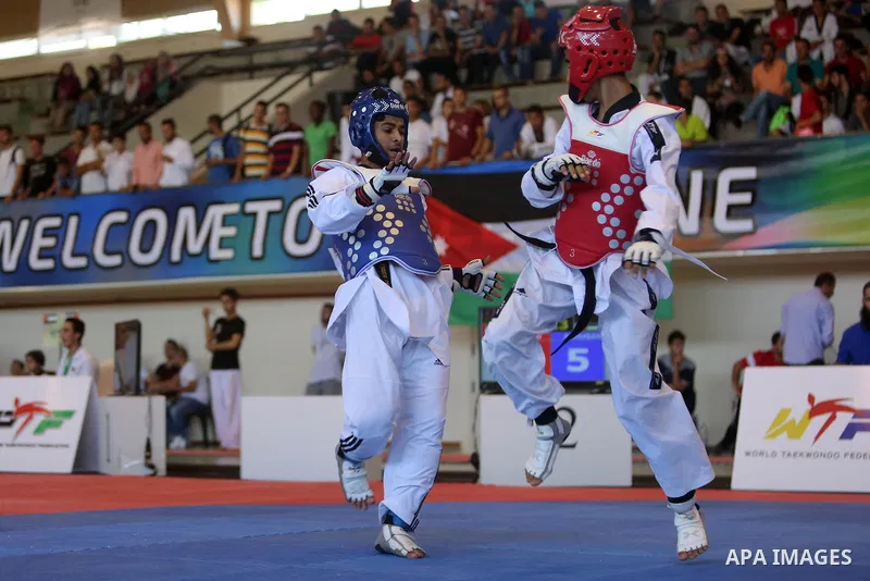 Taekwondo fighters spar during the International Taekwondo Championships at the Birzeit University in the West Bank city of Ramallah on July 19, 2016. Foreign football teams have already played matches in the Palestinian...