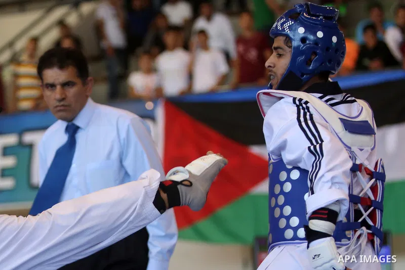 Taekwondo fighters spar during the International Taekwondo Championships at the Birzeit University in the West Bank city of Ramallah on July 19, 2016. Foreign football teams have already played matches in the Palestinian...